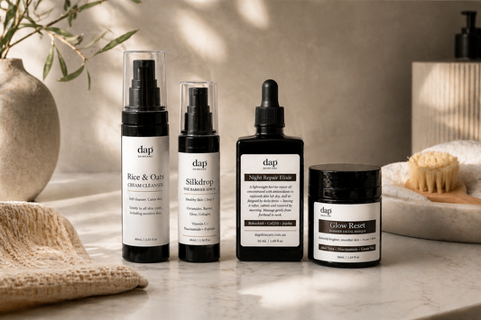 Set of DAP skincare products on a table with a neutral background