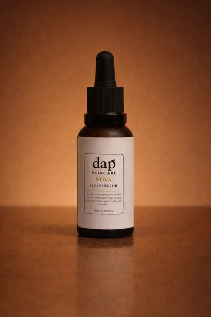 Bottle of dap skincare Nova Cleansing Oil on a brown background