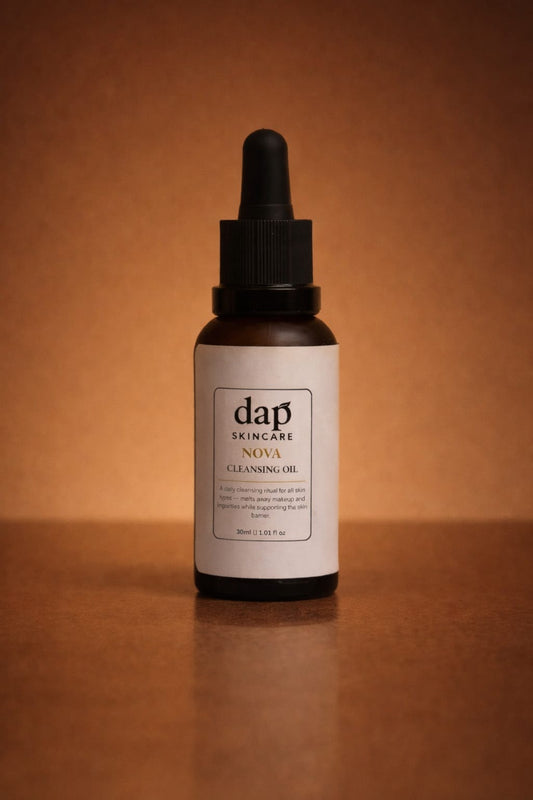 Bottle of dap skincare Nova Cleansing Oil on a brown background