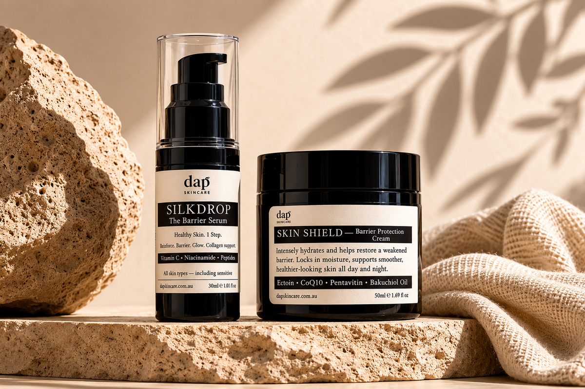 Two skincare products from dap on a stone surface with a natural background